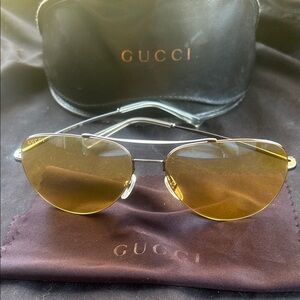 Gucci Gold-Tinted Aviator Sunglasses GG0500s.